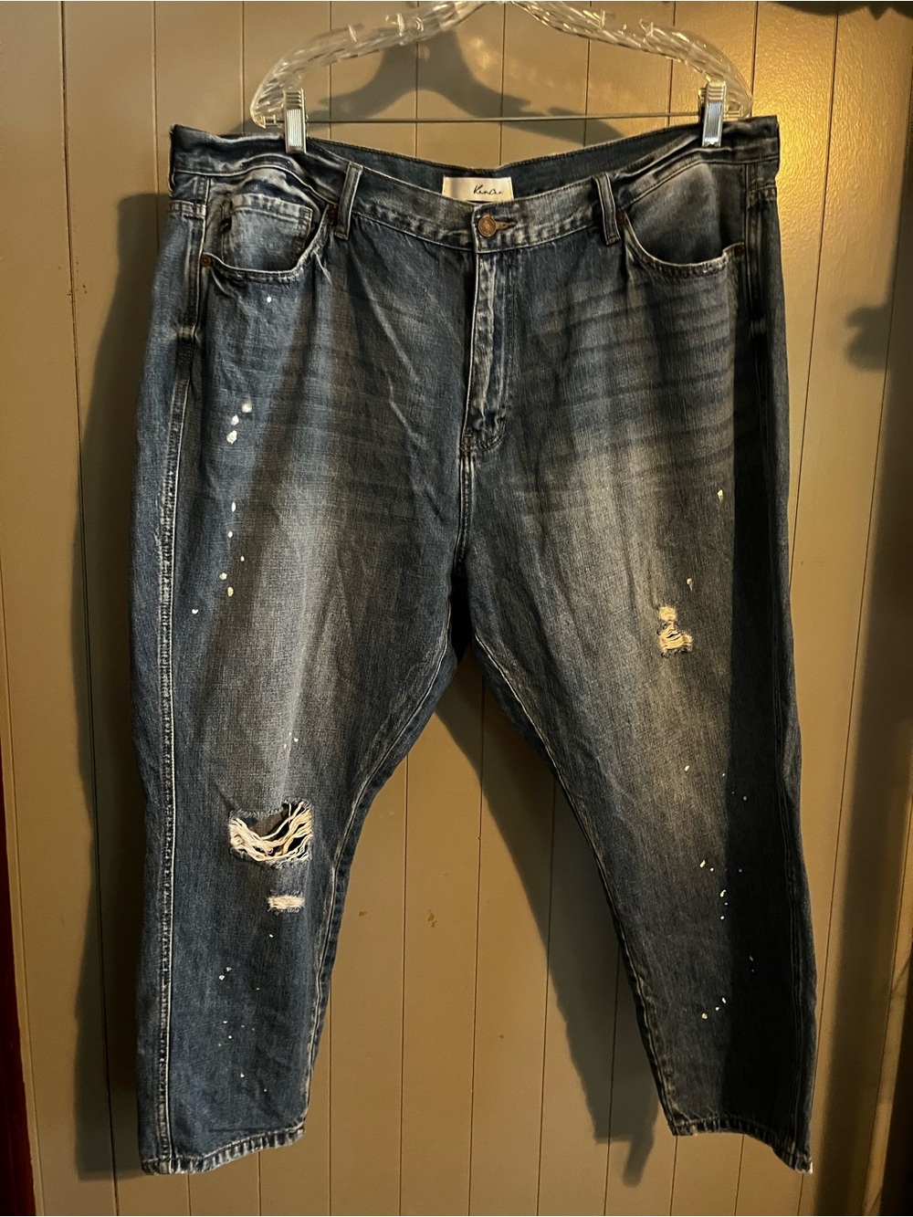 Kancan distressed blue jeans featuring a paint splatter detail
